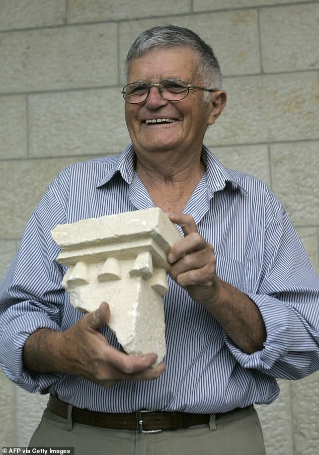 Ehud Netzer holds pieces of an elaborate sarcophagus believed to contain the remains of King Herod.