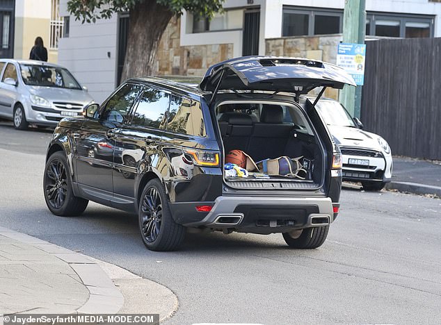 The former Biggest Loser trainer was seen driving with the trunk of her Range Rover completely open because she forgot to close it.