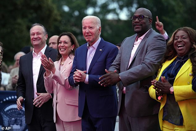 Pictured: Joe Biden, Dough Ehmoff, Kamala Harris, Philonise Floyd, Keeta Floyd. Biden sparks concern when he appears to freeze during the Juneteenth celebration concert at the White House alongside a dancing Kamala Harris, before Floyd, brother of the late George Floyd, puts his arm around him.