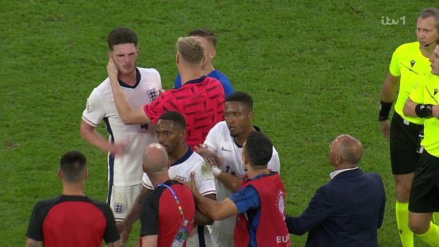 There were angry scenes after the final whistle, with footage showing Slovakia manager Francesco Calzona pushing Declan Rice (left).