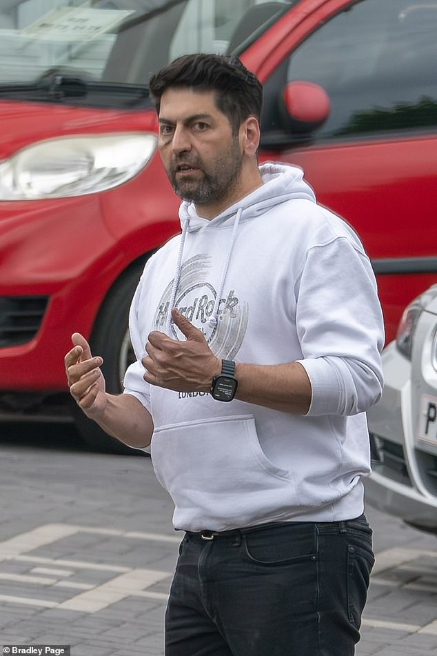 Farshad Kia, 45 (pictured), has sparked multiple complaints after displaying numerous used cars in or next to the driveway of his 1930s semi-trailer.