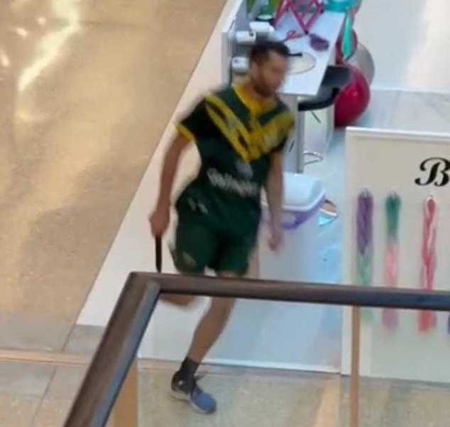 Joel Cauchi is pictured carrying the knife he used to murder six people in Bondi Junction.