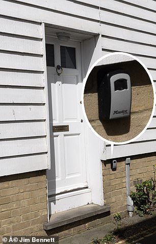 Lock boxes on cottage doors in Whitstable indicate their use as Airbnb properties