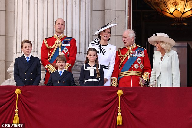 Members of the Royal Family watch the flight from the balcony of Buckingham Palace today.