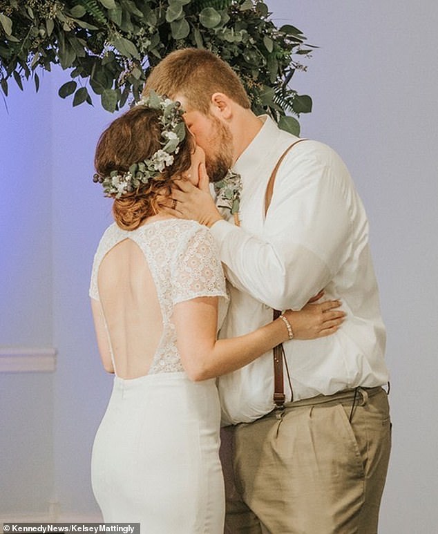 The couple kisses after exchanging vows. They were married for only an hour before Mary was rushed to the hospital.