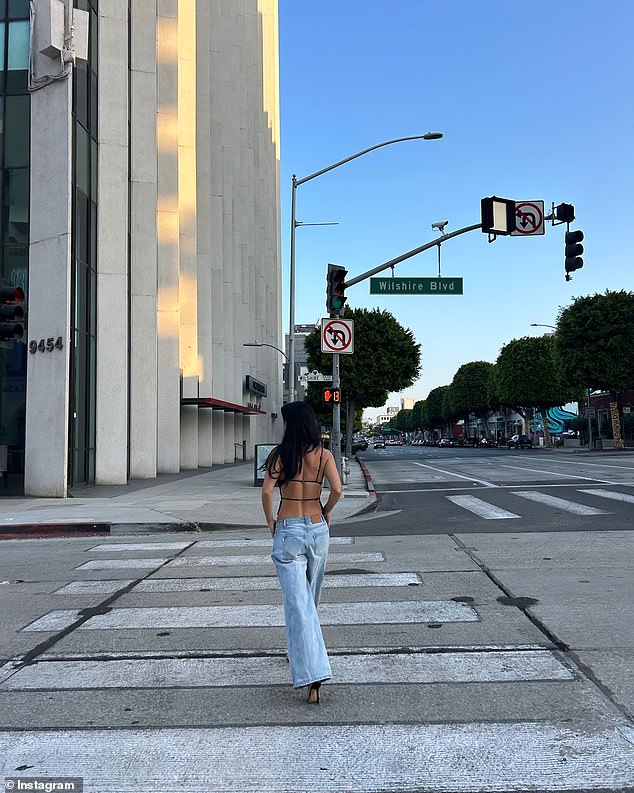 In a series of photos shared on Instagram, the brunette bombshell left little to the imagination in a backless black top.