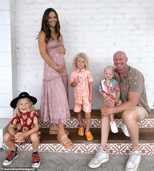 The entertainer and her soccer player husband announced that they are expecting their fourth child together in January. Pictured: Lauren and Barry with their children Miller, Houston and Samson.