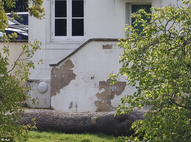 Photos taken last month show paint crumbling and cracks forming on the walls of Prince Andrew's Royal Lodge home.