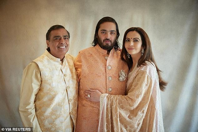 Anant (centre) is the son of Reliance Industries chairman Mukesh Ambani (left), who is Asia's richest person according to Forbes and has a fortune of more than $114 billion (pictured with his girlfriend Radhika).