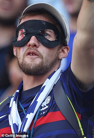 Some fans chose to wear black masks similar to Mbappé's while others opted for different designs.