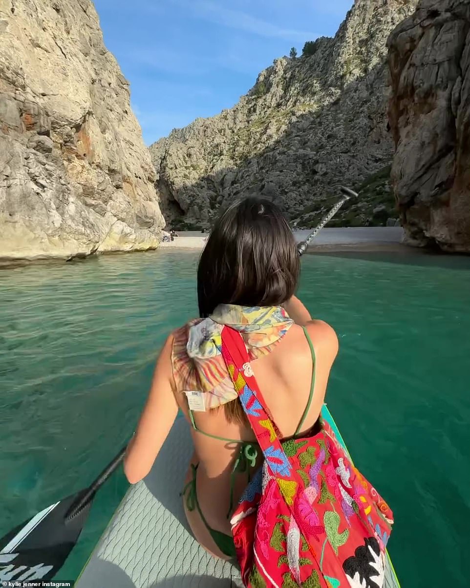 The friend carried an embroidered bag on her shoulder.