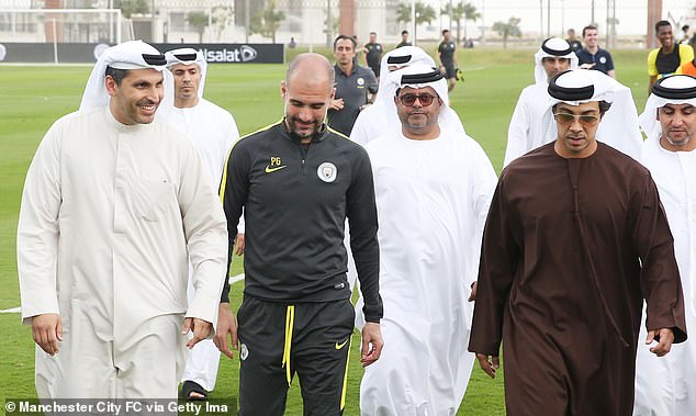 Manchester City manager Pep Guardiola (second from left) with club owner Sheikh Mansour (right).