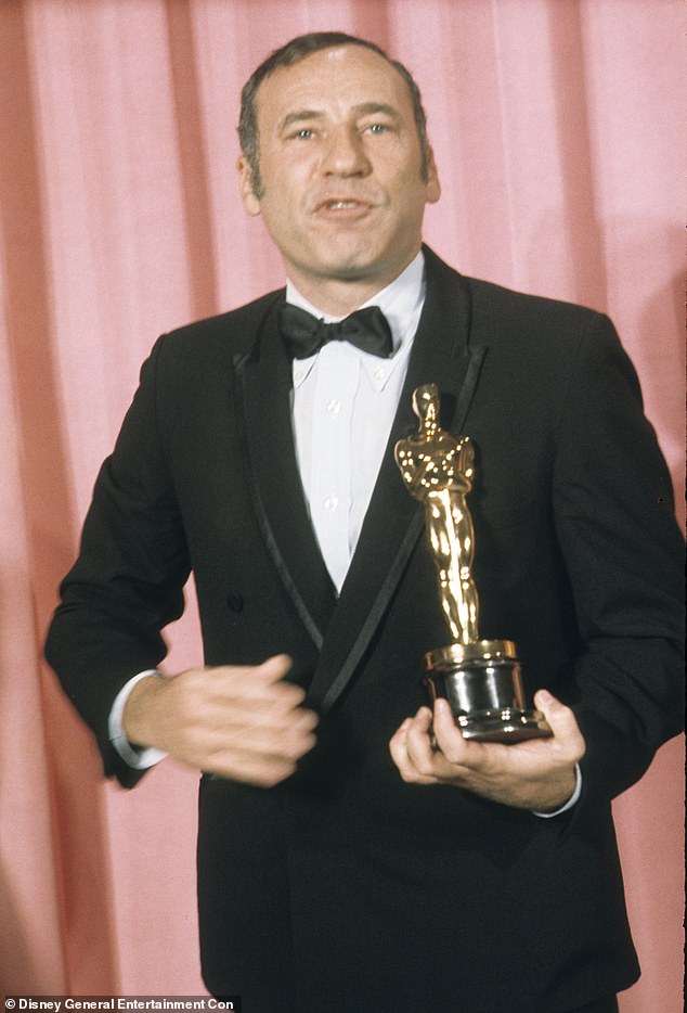 Brooks is among 19 people who have ever achieved EGOT status, which is the acronym for winning Emmy, Grammy, Oscar and Tony awards; The iconic filmmaker is seen accepting his Academy Award for Best Original Screenplay for The Producers (1967)