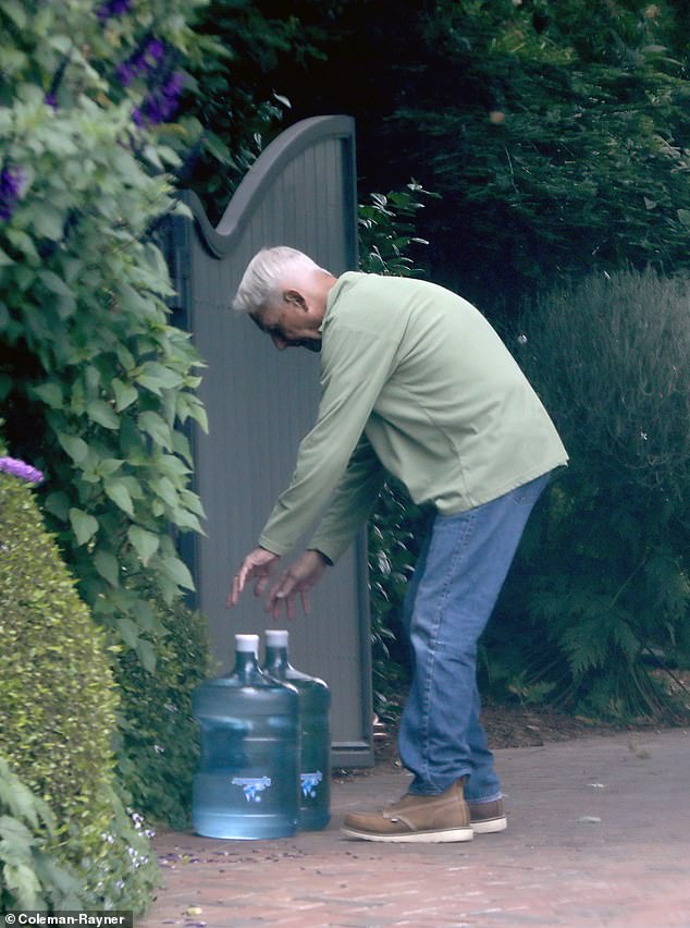 He effortlessly lifted not one, but two heavy water jugs, each weighing at least 42 pounds, as he walked back to his Pacific Palisades abode.