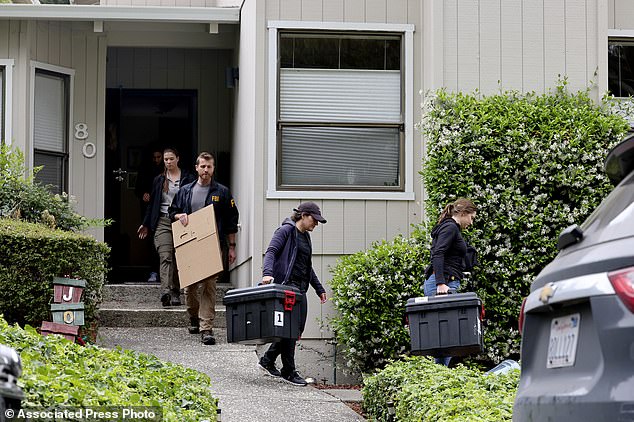 FBI agents remove boxes from a home associated with Oakland Mayor Sheng Thao during a raid in Oakland, California, on Thursday.