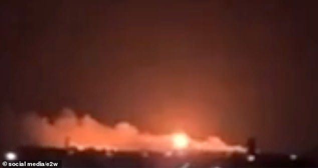 Footage taken of a burning oil tank in the distance after a Ukrainian airstrike