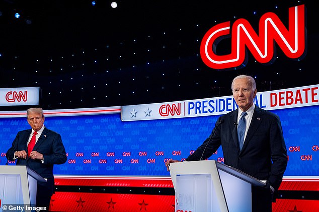 Republican presidential candidate former President Donald Trump (L) looks at US President Joe Biden during the CNN presidential debate