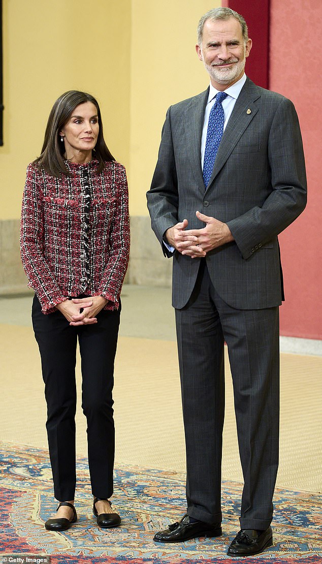 The royal, 51, looked in high spirits as she greeted officials alongside King Felipe at the El Pardo Royal Palace in the Spanish capital.