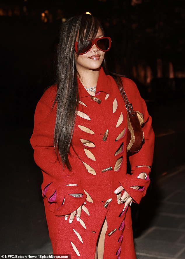 The multiple Grammy Award winner, 36, emerges from the back seat of a chauffeured SUV dressed in a sexy all-red look.