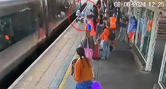 Onlookers said the baby's mother and grandmother were distraught after the stroller crossed the station's yellow line and crashed into the side of the train.