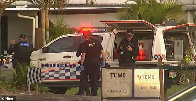 Police are shown processing the scene on Robb Place in South Mackay, on Wednesday after the alleged double shooting.