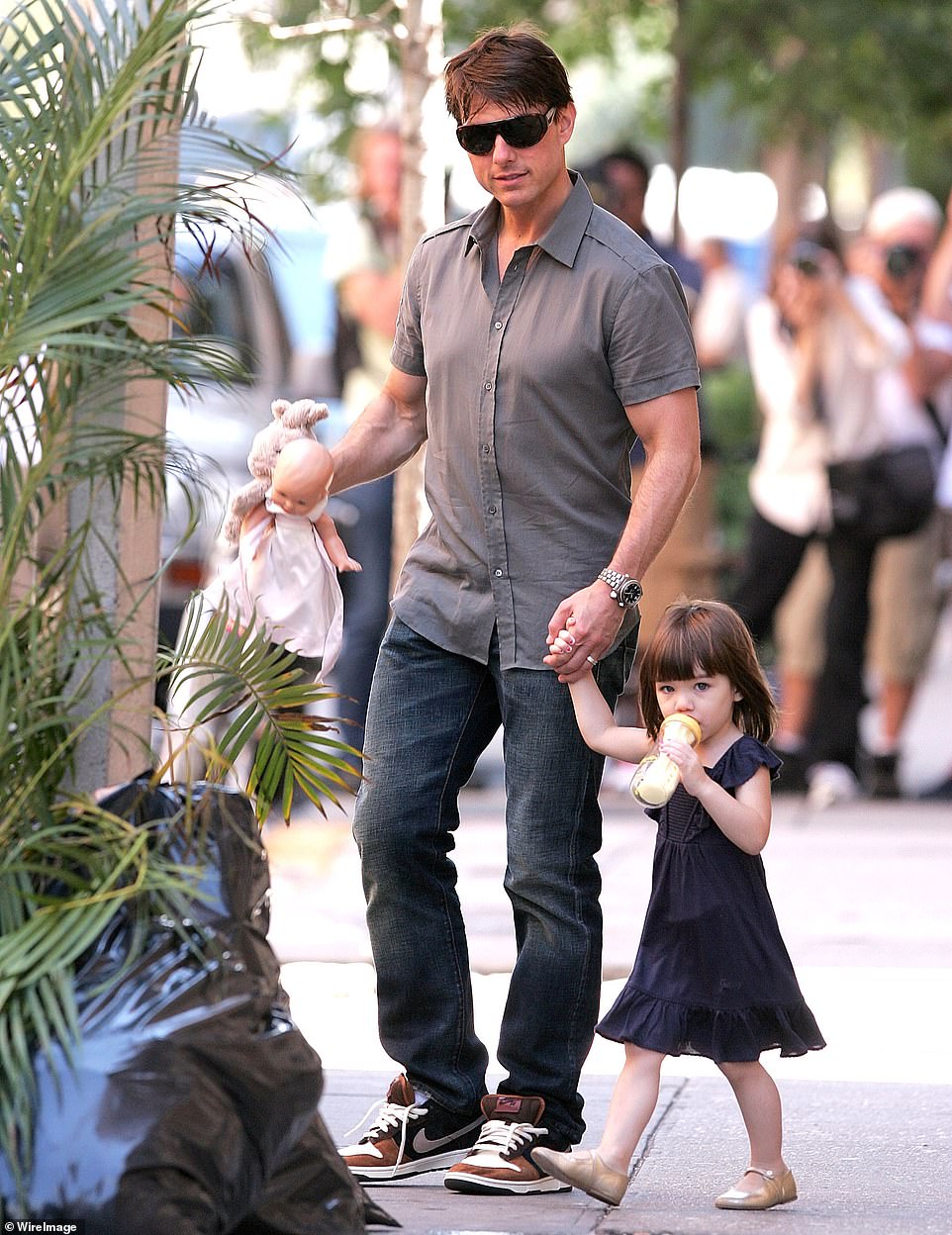 Father Cruise was seen with a very young Suri on the streets of Manhattan in 2008, when he was still married to Holmes.