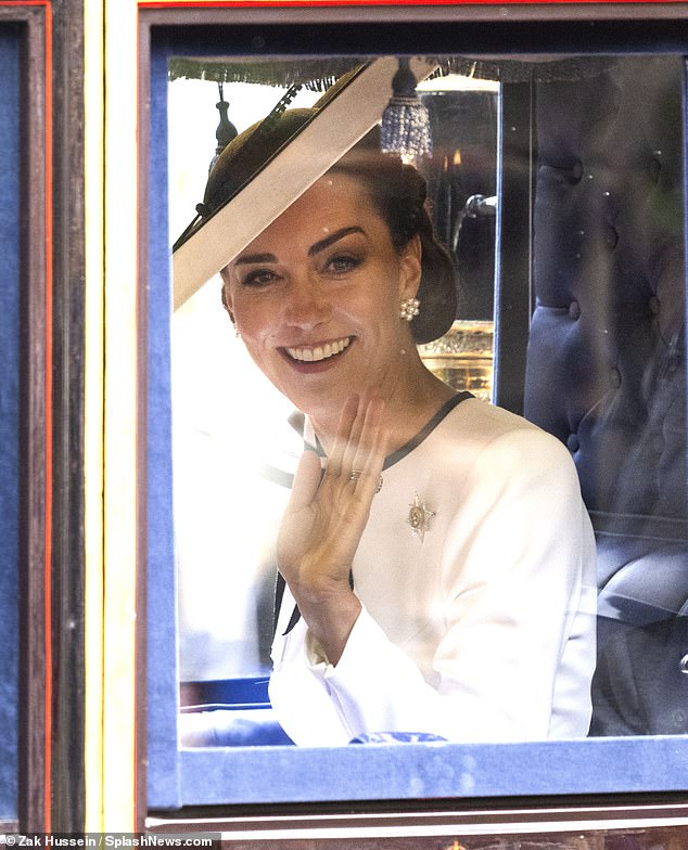 The Princess of Wales, 42, appeared in high spirits as she waved to the crowds lining The Mall (pictured).