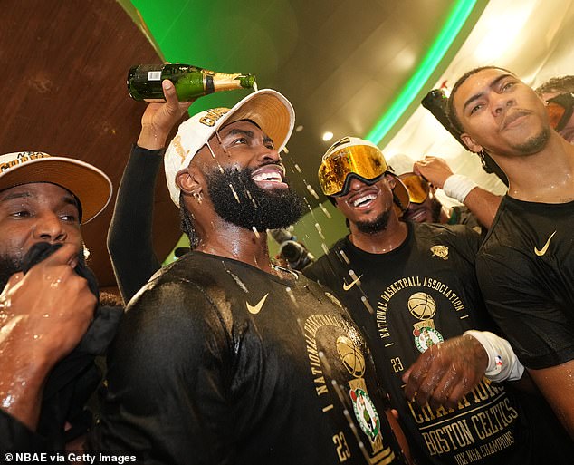 Jaylen Brown had beer poured over his head as he watched the celebrations unfold.