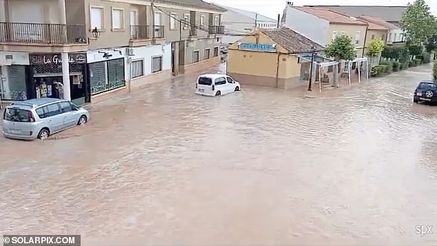 Images from the Costa Blanca showed submerged streets (pictured), overflowing rivers and water moving quickly across dry fields before crashing onto roads.