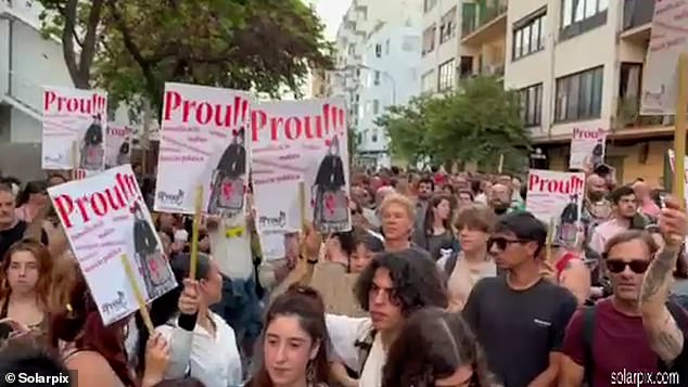 Protesters are seen marching through Ibiza calling on the local government to impose restrictions on mass tourism on the island.