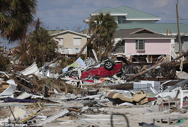 Experts have warned against buying property in climate disaster-prone states like Florida (pictured: destruction left behind by Hurricane Ian in Florida in 2022)