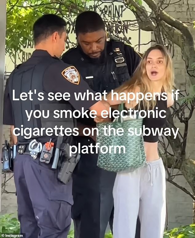 Woman is seen raising her hand to slap an NYPD