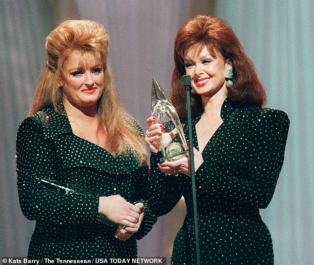 Wynonna, left, and Naomi Judd, right, accepted their eighth consecutive CMA Award during the 25th Annual CMA Awards at the Grand Ole Opry House in 1991.