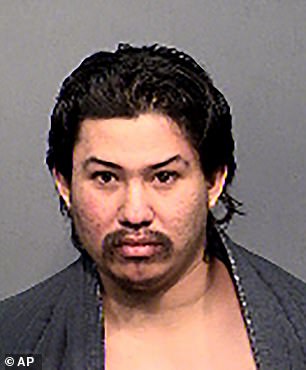 This undated booking photo provided by the Flagstaff Police Department shows Martinez.