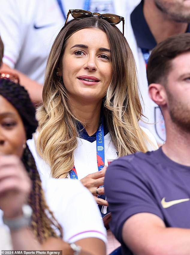 Dani proudly supported her partner in a white England shirt as she smiled at Jarrod, who was wearing his team's blue sweatshirt.