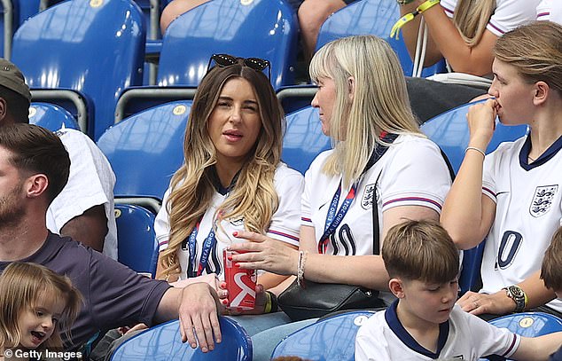 He chatted with other family members in the stands.