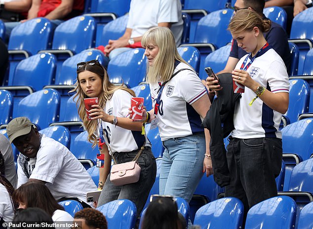 They sat in their seats before the match in Germany.