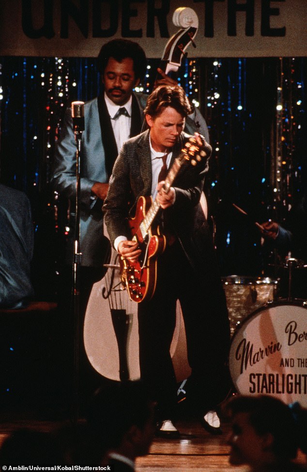 Chris previously spoke about how seeing Michael on guitar playing Johnny B. Goode in an iconic scene from 1985's Back to the Future (pictured) was his inspiration to become a musician.