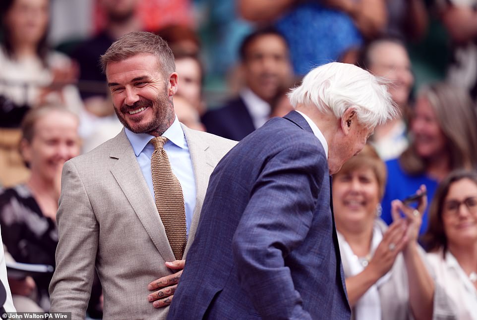 Beckham couldn't wipe the smile off his face as he squeezed to let his teammate David pass.