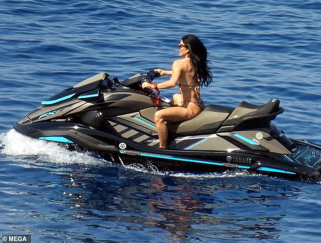 Over the weekend, the former journalist showed that she is still young at heart by hopping on a jet ski and riding the waves while dazzling in a gold bikini.