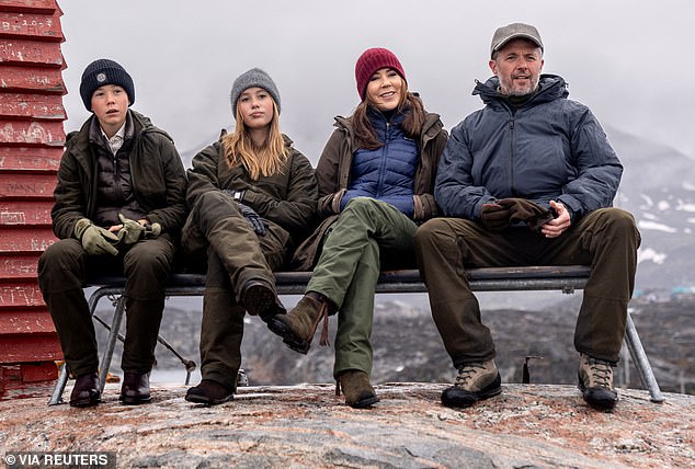 The family posed for a photo during a visit to a whale microphone viewpoint in Qeqertarsuaq