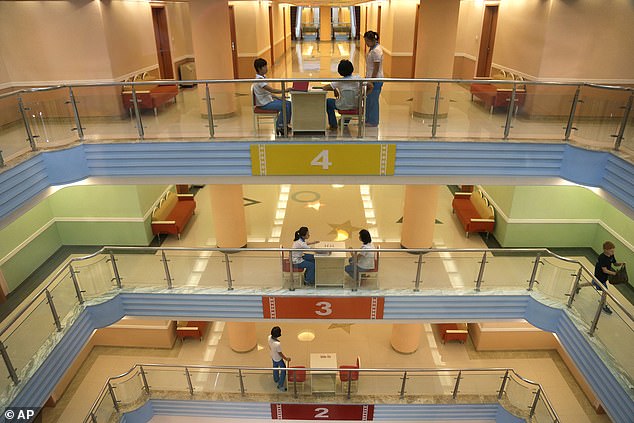 The hallway of the dormitory at the Songdowon International Children's Camp is painted in pastel colors, Tuesday, July 29, 2014, in Wonsan, North Korea.