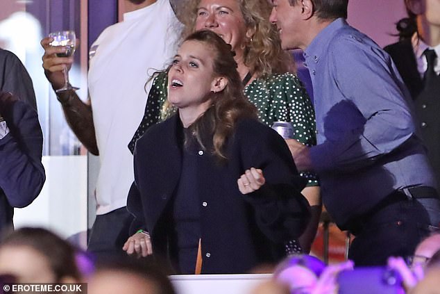 Prince Andrew's eldest daughter, who was spotted at the Glastonbury festival earlier in the day, wore a simple navy blue blouse and a light black jacket.