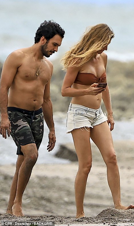 The couple looked relaxed as they spent time on the beach.