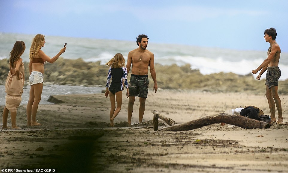 Gisele proudly took photos of Joaquim interacting with his children