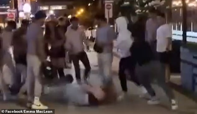 A video showed the group of seven to ten men kicking one of the women, who was lying on the ground surrounded by her attackers, while the other struggled to free herself from the clutches of another man.