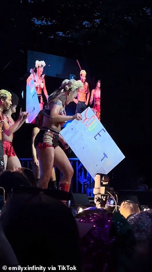 JoJo (born Joelle Joanie) then held up a handmade sign promoting her new single Guilty Pleasure.