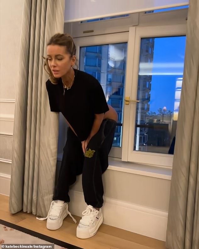 In the clip, Beckinsale wore a black T-shirt with black sweatpants and white sneakers with her light brown locks pulled back into a ponytail as she looked out the window to release stress amid the tense moment.