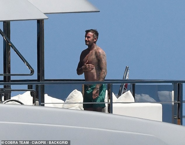 David showed off his tattooed physique while enjoying the Sardinian sun