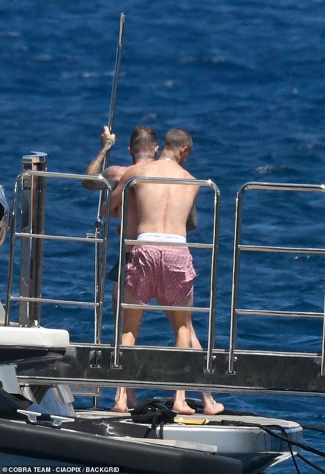 The 21-year-old was having fun with his father as they took a shower after a swim.